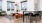a living room with a table and chairs