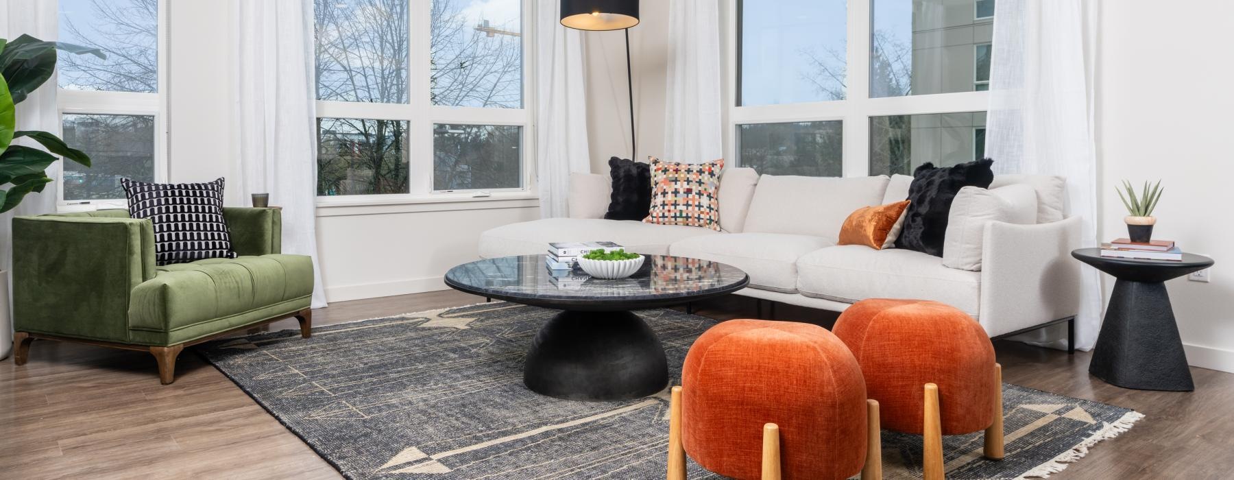 a living room with a rug and a couch