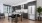 a kitchen with a bar stool and a table