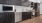 a kitchen with black cabinets