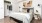 a bedroom with a bed and a table